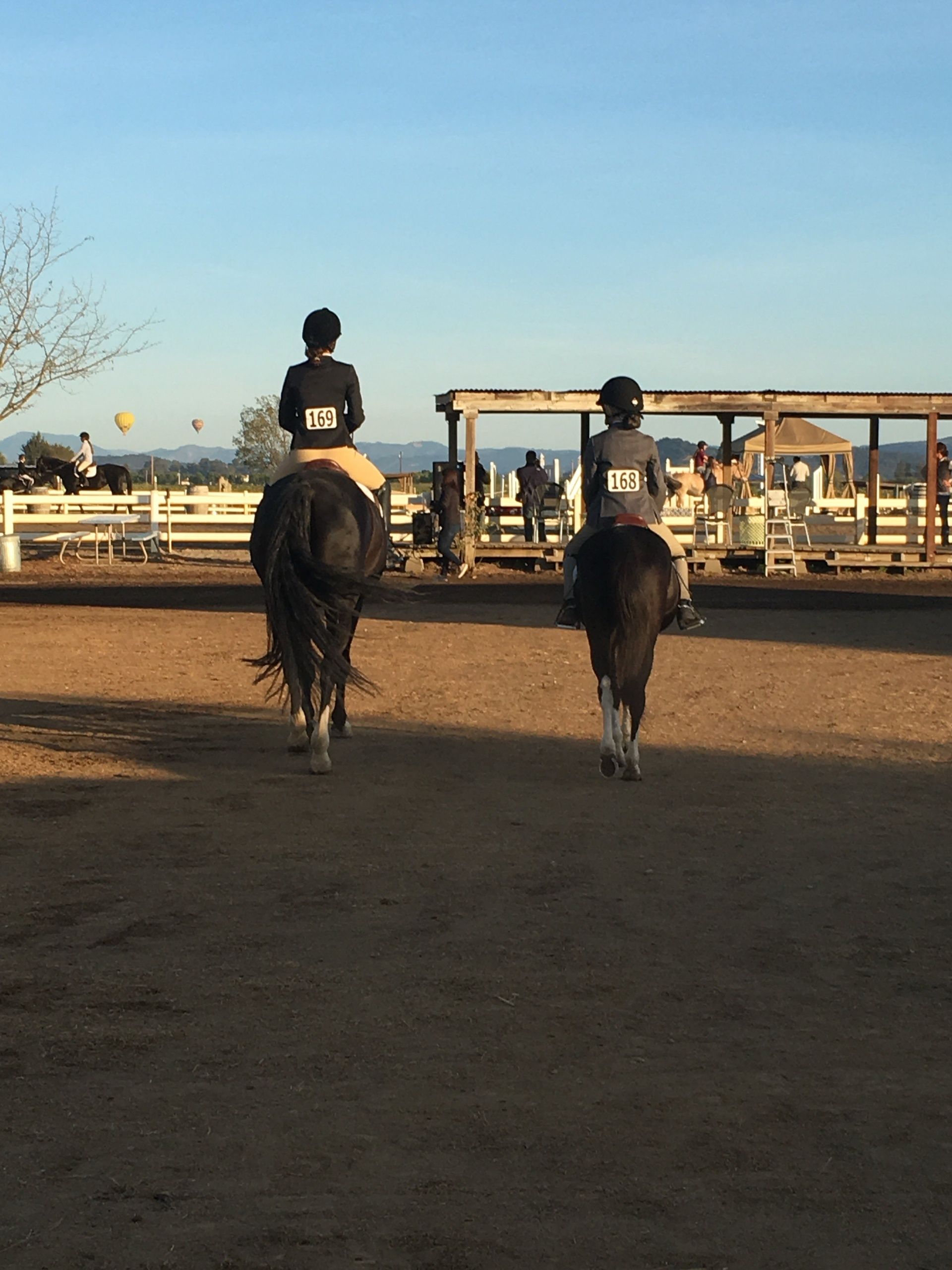 Dawn ride at 'The Farm | Sonoma,' hot air balloons aloft, serene mountain silhouette.